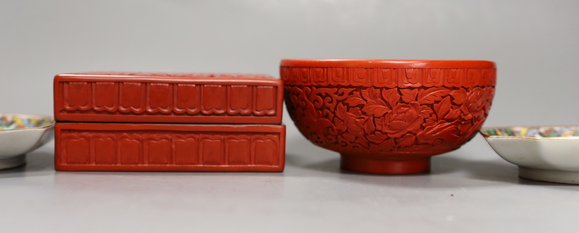 A Chinese cinnabar lacquer bowl, a similar box and cover and two Chinese famille verte thousand butterfly dishes